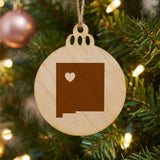 New Mexico round wood Christmas ornament engraved with the state shape and a heart