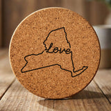 New York round cork coaster engraved with a hand-drawn state outline and love in cursive