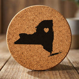 New York round cork coaster engraved with the state shape and a heart