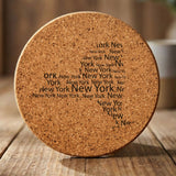 New York round cork coaster engraved with a word cloud of repeating New York text