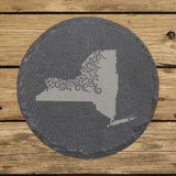 New York round slate coaster engraved with the state shape in ornate floral scrollwork