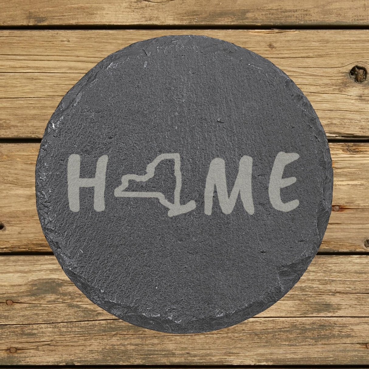 New York round slate coaster engraved with HOME using the state outline as the letter O