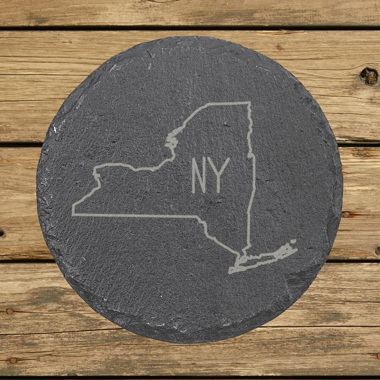 New York round slate coaster engraved with the state outline and NY initials