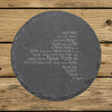 New York round slate coaster engraved with a word cloud of repeating New York text