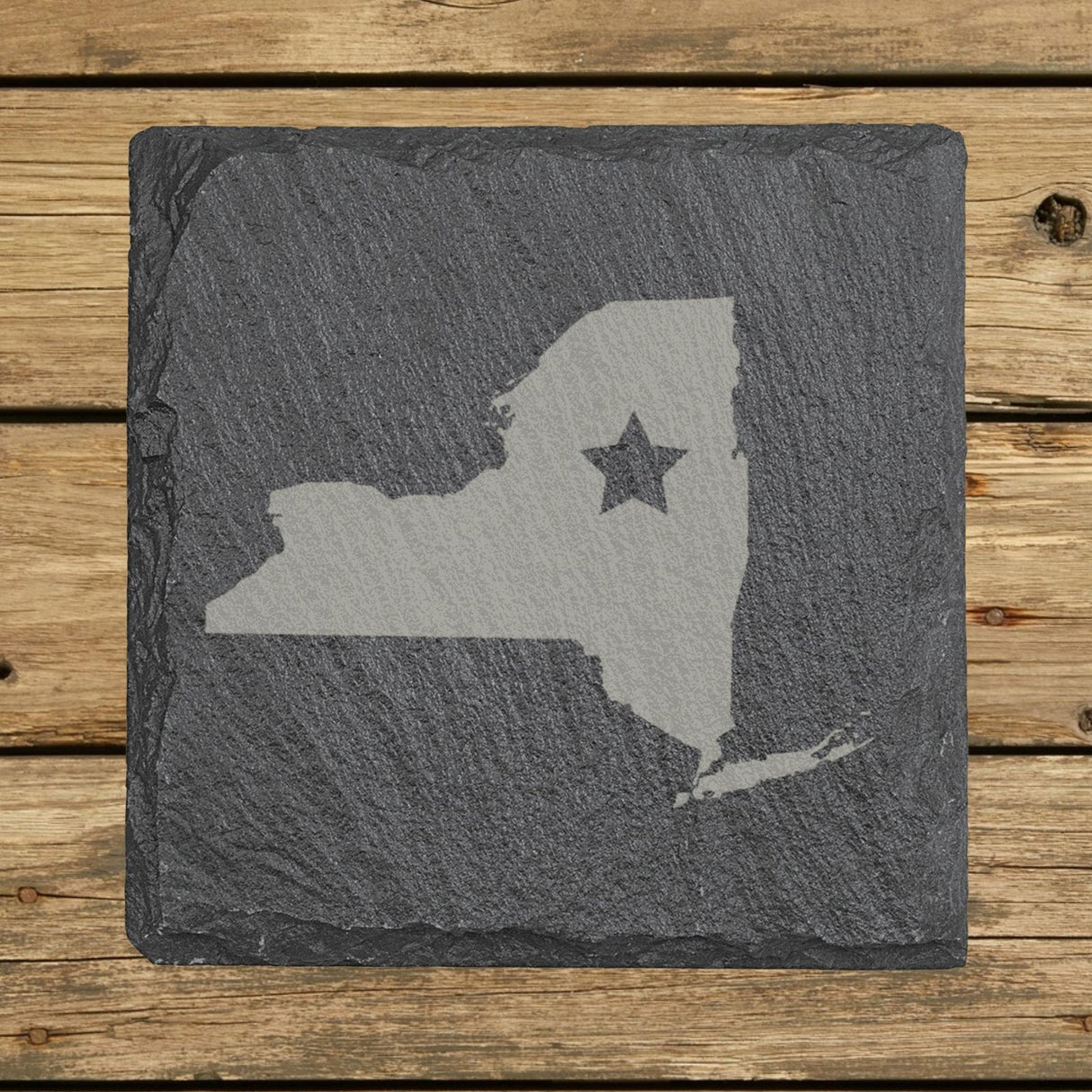 New York square slate coaster engraved with the state shape and a star