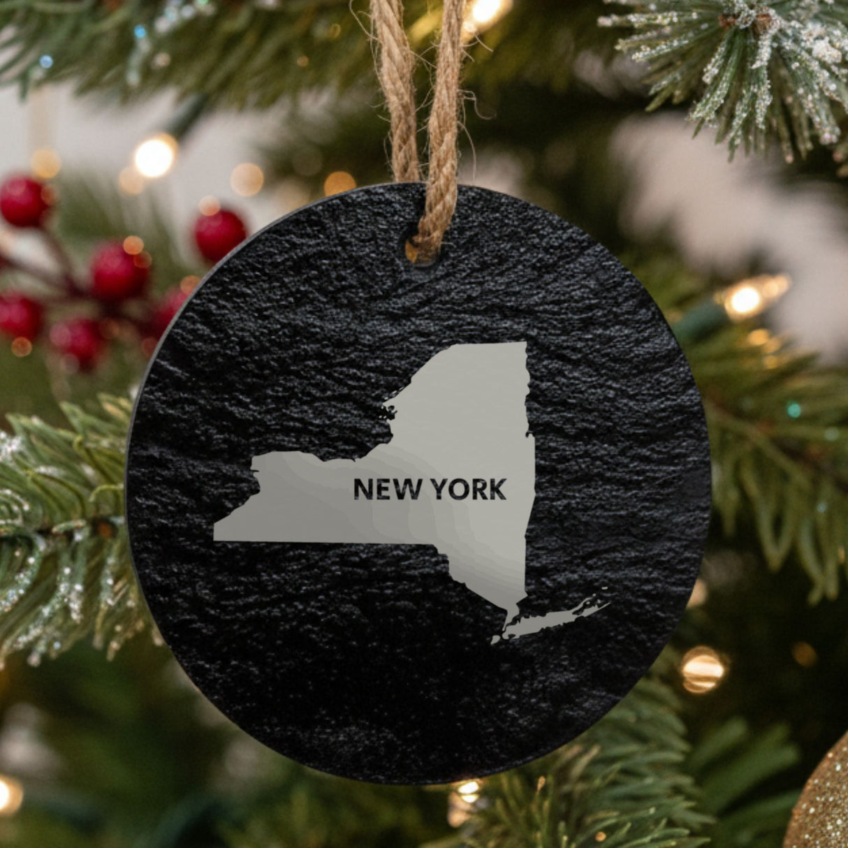 New York round slate Christmas ornament engraved with the state shape and NEW YORK in bold lettering