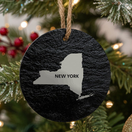 New York round slate Christmas ornament engraved with the state shape and NEW YORK in bold lettering