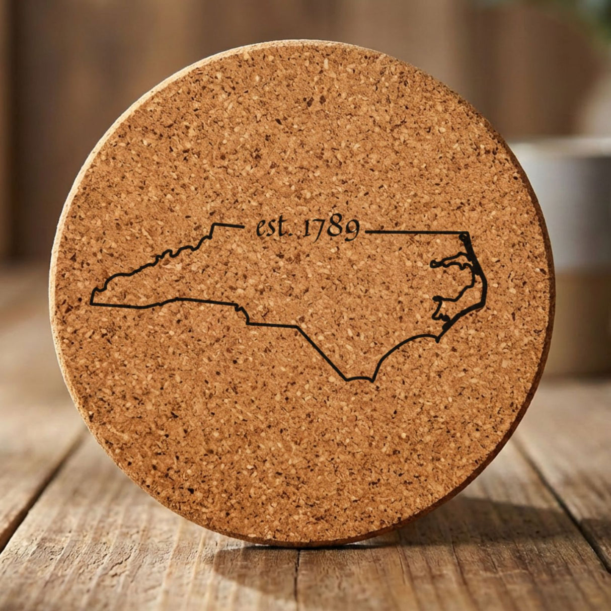 North Carolina round cork coaster engraved with the state outline and est. 1789