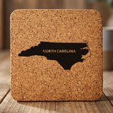 North Carolina square cork coaster engraved with the state shape and NORTH CAROLINA in bold lettering