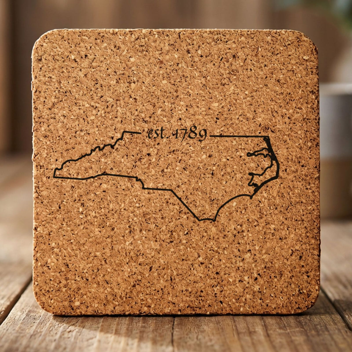 North Carolina square cork coaster engraved with the state outline and est. 1789