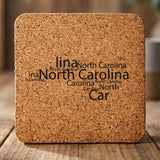 North Carolina square cork coaster engraved with a word cloud of repeating North Carolina text