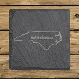 North Carolina square slate coaster engraved with the state outline and NORTH CAROLINA in hand-drawn brush lettering