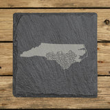 North Carolina square slate coaster engraved with the state shape in ornate floral scrollwork