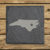 North Carolina square slate coaster engraved with the state shape and a star
