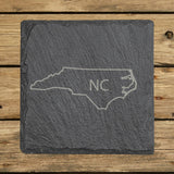 North Carolina square slate coaster engraved with the state outline and NC initials
