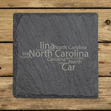 North Carolina square slate coaster engraved with a word cloud of repeating North Carolina text