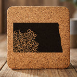 North Dakota square cork coaster engraved with the state shape in ornate floral scrollwork