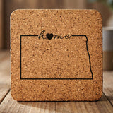 North Dakota square cork coaster engraved with the state outline and home in script with a heart