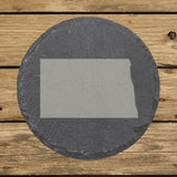 North Dakota round slate coaster with the full state shape engraved