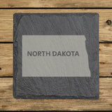North Dakota square slate coaster engraved with the state shape and NORTH DAKOTA in bold lettering