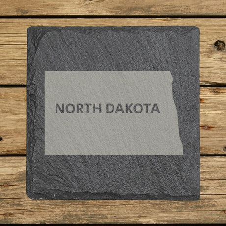 North Dakota square slate coaster engraved with the state shape and NORTH DAKOTA in bold lettering