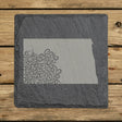 North Dakota square slate coaster engraved with the state shape in ornate floral scrollwork