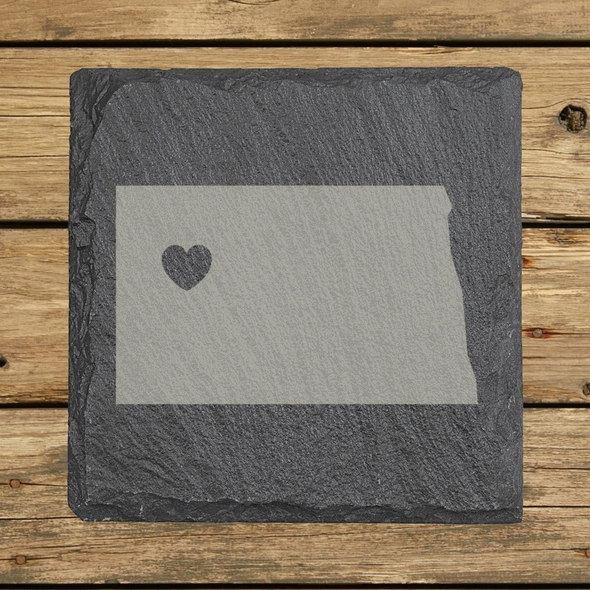 North Dakota square slate coaster engraved with the state shape and a heart