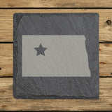 North Dakota square slate coaster engraved with the state shape and a star