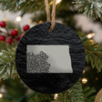 North Dakota round slate Christmas ornament engraved with the state shape in ornate floral scrollwork