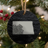 North Dakota round slate Christmas ornament engraved with the state shape in ornate floral scrollwork
