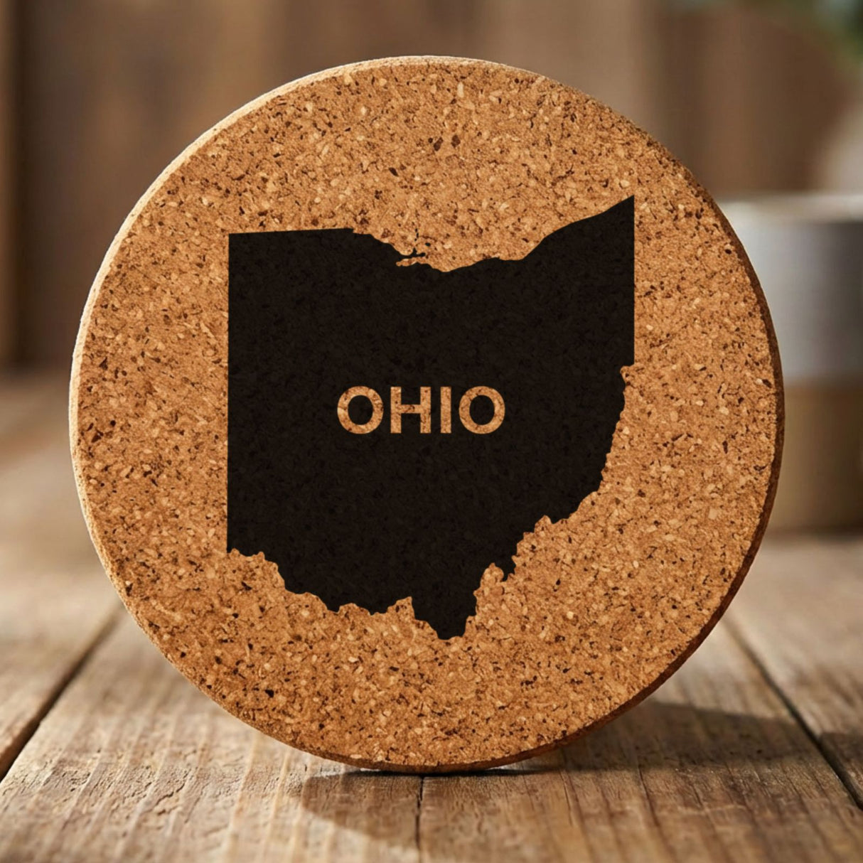 Ohio round cork coaster engraved with the state shape and OHIO in bold lettering
