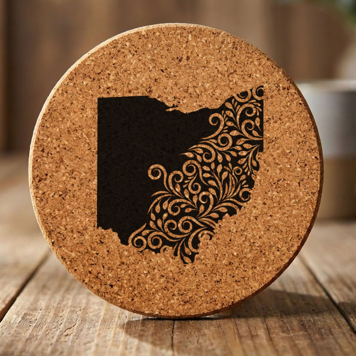 Ohio round cork coaster engraved with the state shape in ornate floral scrollwork