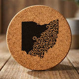Ohio round cork coaster engraved with the state shape in ornate floral scrollwork