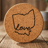 Ohio round cork coaster engraved with a hand-drawn state outline and love in cursive