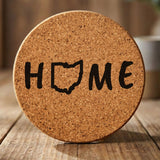 Ohio round cork coaster engraved with HOME using the state outline as the letter O