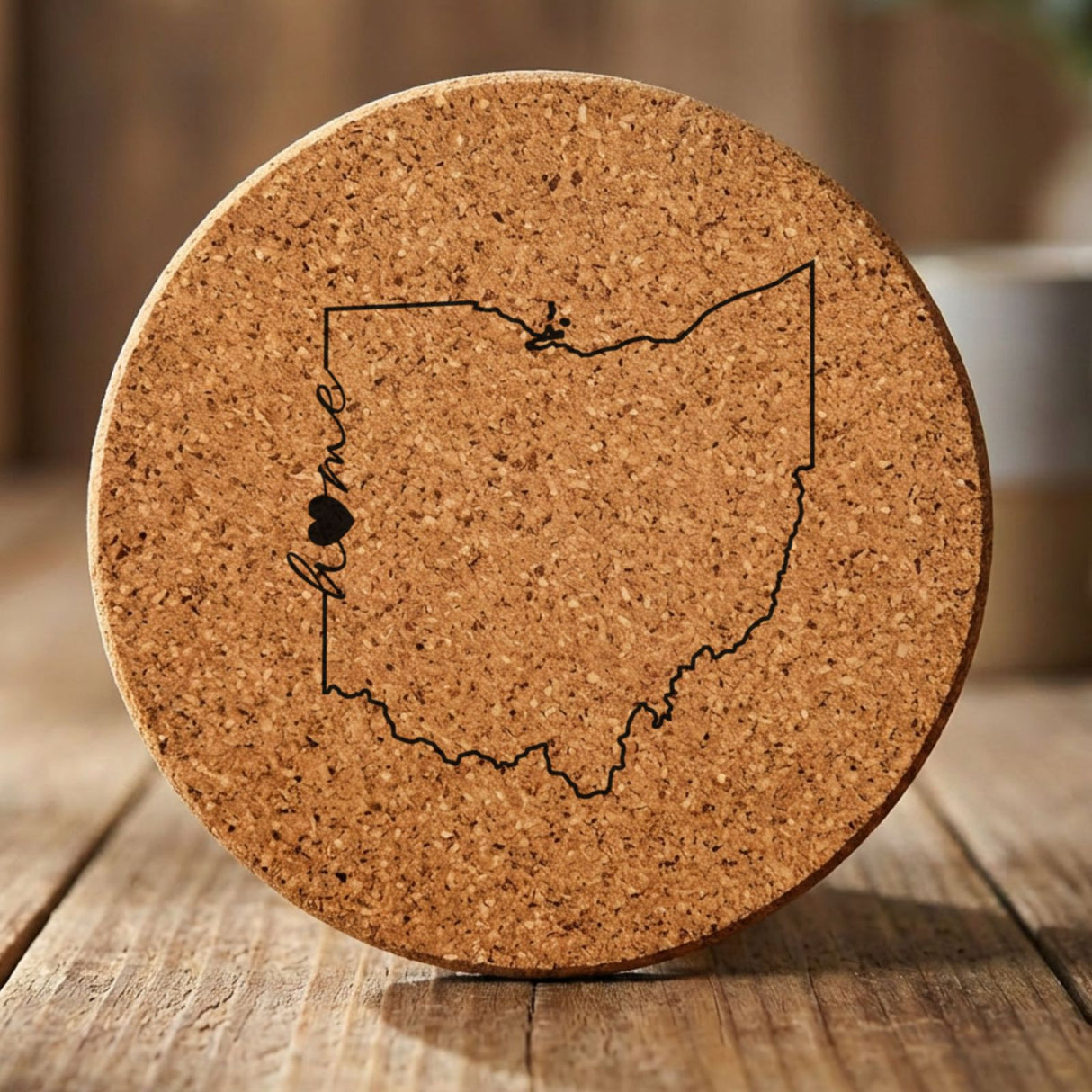Ohio round cork coaster engraved with the state outline and home in script with a heart