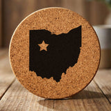 Ohio round cork coaster engraved with the state shape and a star