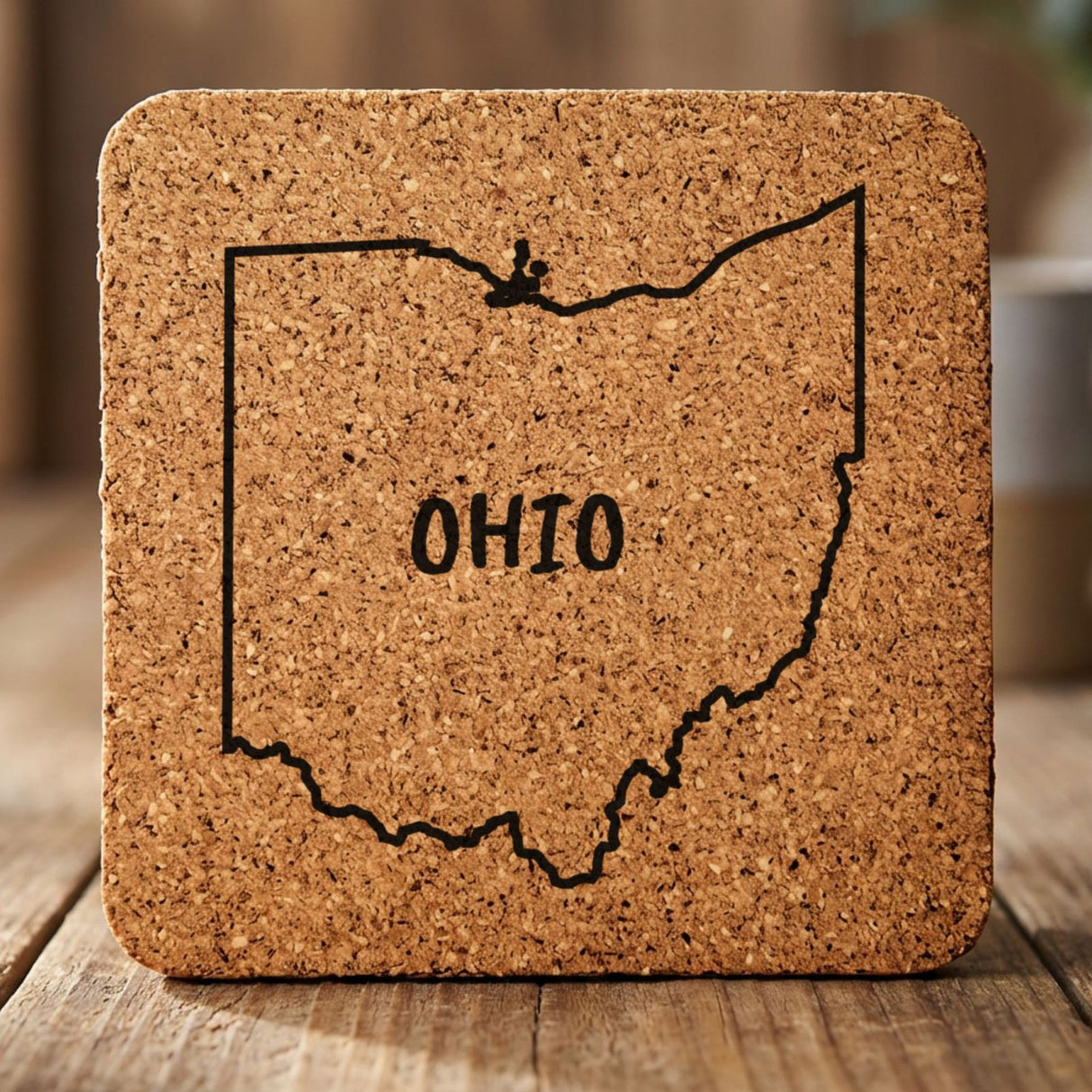 Ohio square cork coaster engraved with the state outline and OHIO in hand-drawn brush lettering