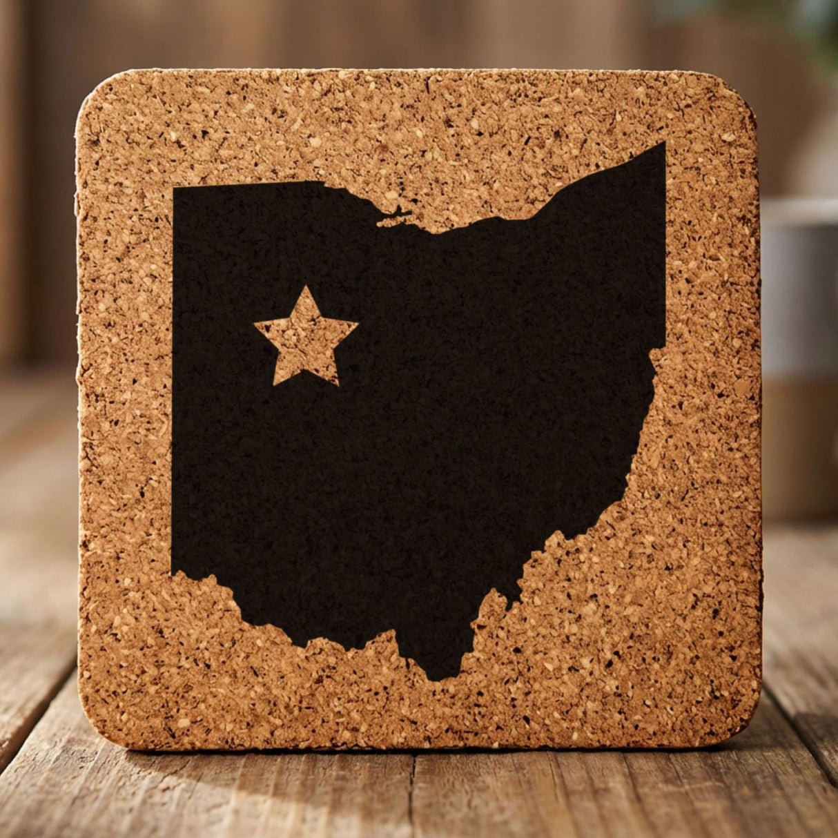 Ohio square cork coaster engraved with the state shape and a star