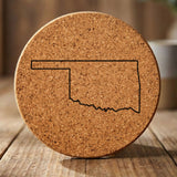 Oklahoma round cork coaster engraved with a clean state outline