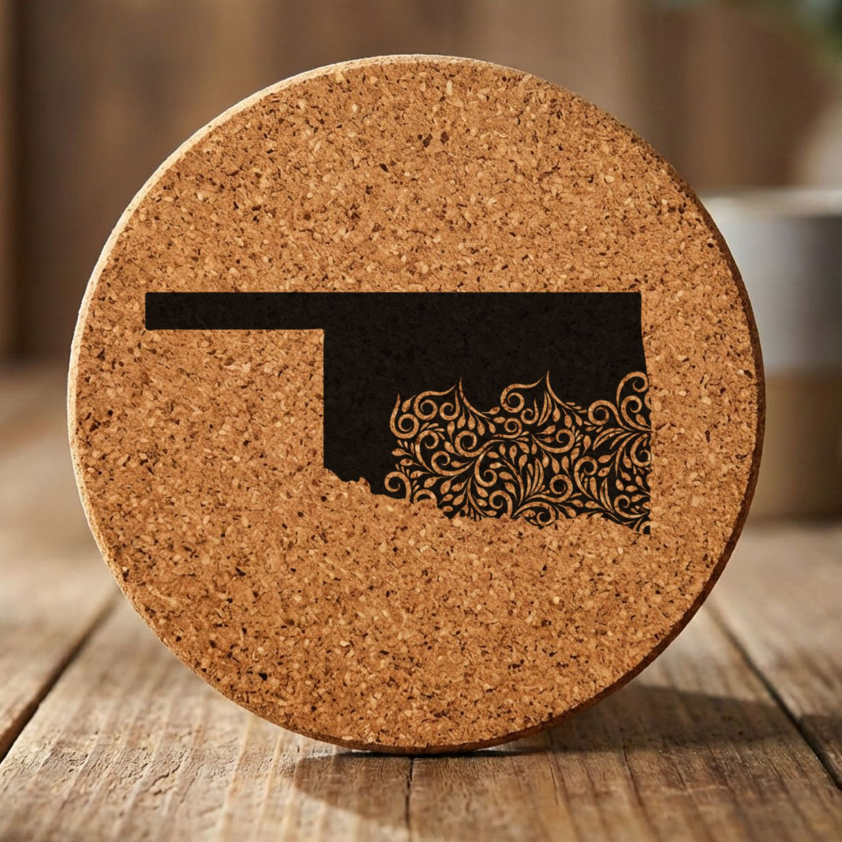 Oklahoma round cork coaster engraved with the state shape in ornate floral scrollwork