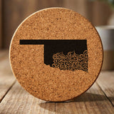 Oklahoma round cork coaster engraved with the state shape in ornate floral scrollwork
