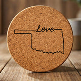 Oklahoma round cork coaster engraved with a hand-drawn state outline and love in cursive