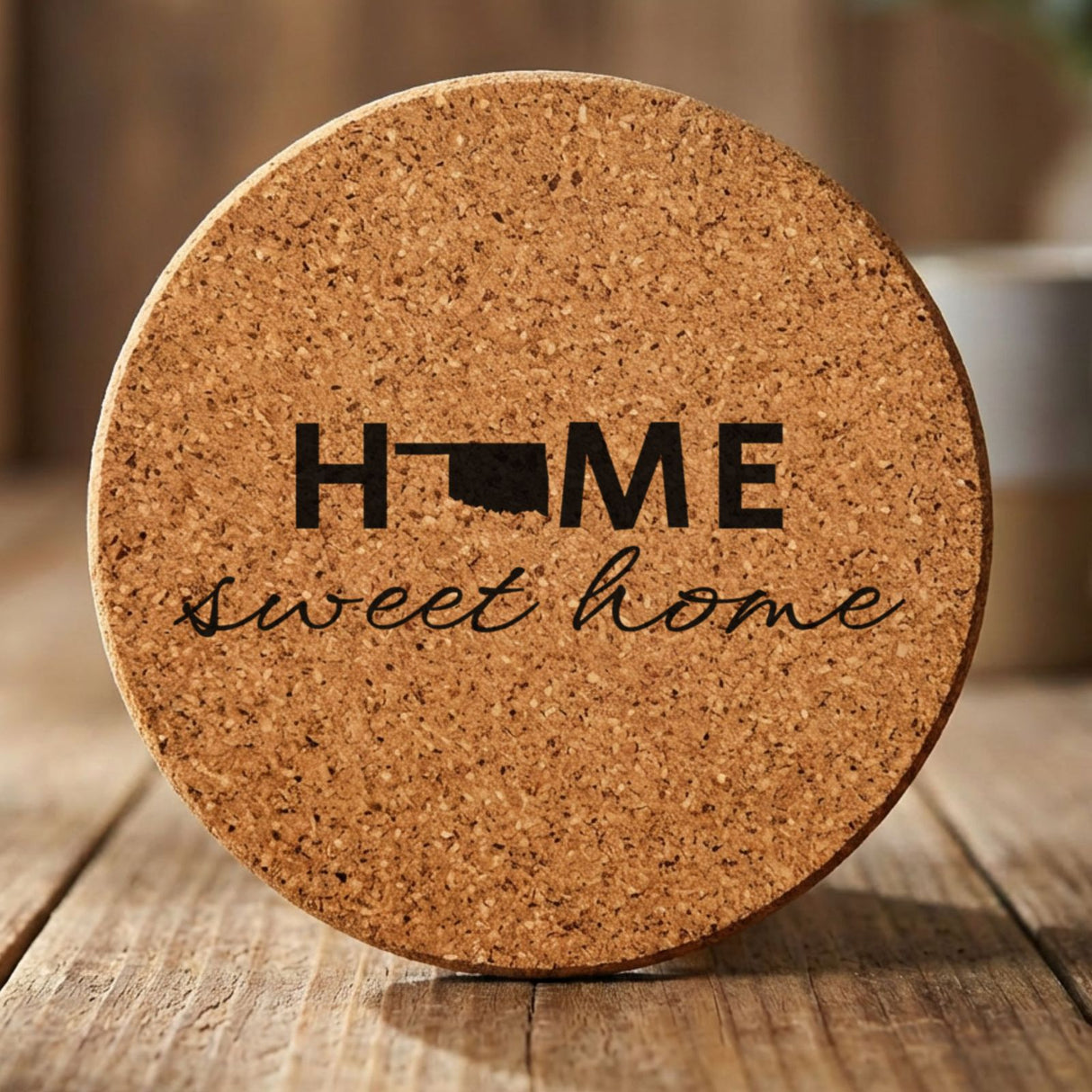 Oklahoma round cork coaster engraved with HOME sweet home using the state shape as the letter O