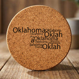 Oklahoma round cork coaster engraved with a word cloud of repeating Oklahoma text