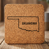 Oklahoma square cork coaster engraved with the state outline and OKLAHOMA in hand-drawn brush lettering