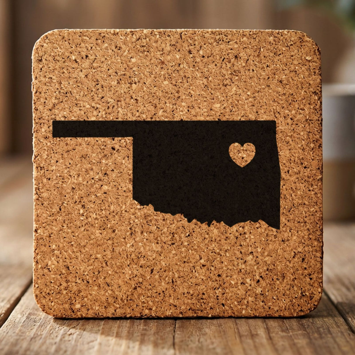 Oklahoma square cork coaster engraved with the state shape and a heart