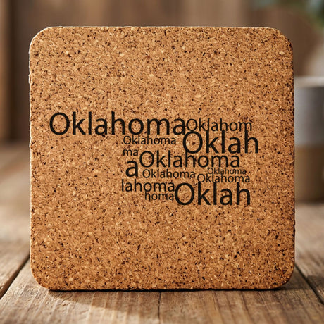 Oklahoma square cork coaster engraved with a word cloud of repeating Oklahoma text