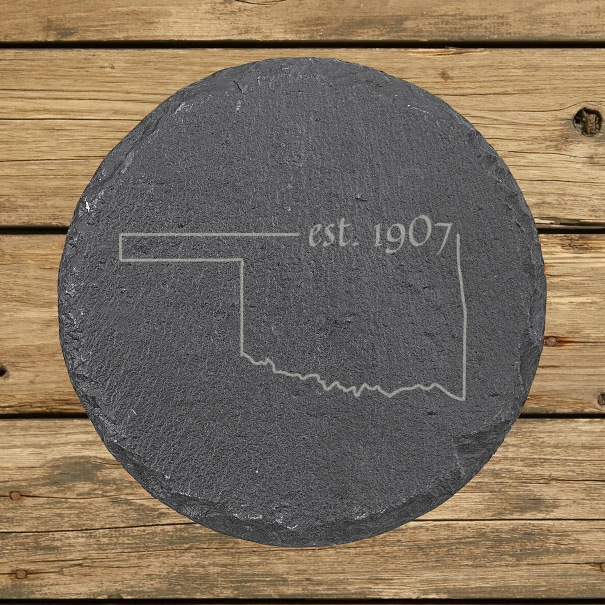 Oklahoma round slate coaster engraved with the state outline and est. 1907
