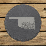 Oklahoma round slate coaster engraved with the state shape in ornate floral scrollwork
